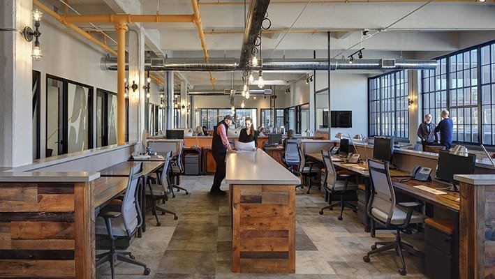 Successful corporate workspaces include a variety of workstations and the ability to easily collaborate, especially important with creative agencies such as the Traction Factory in Milwaukee, Wisconsin