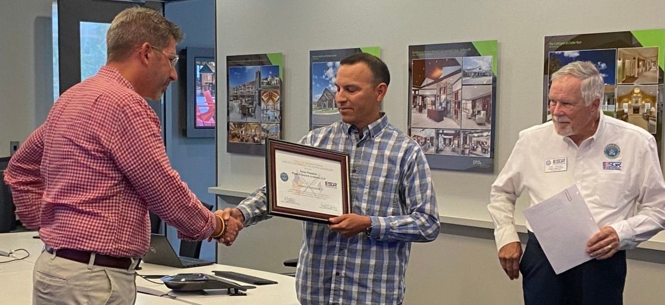 PRA Partner Jason Puestow receives The Patriot Award after being nominated by Adam Herrera of the United States Army Reserve.  Bob Strange, Area 2 Chair of the ESGR, presented the award and a certificate highlighting PRA's support for the Guard and Reserve.