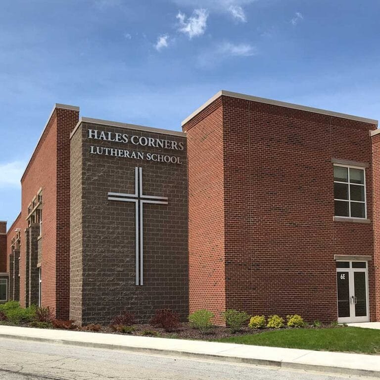 Hales Corners Lutheran Church and School image showing exterior signage and Cross