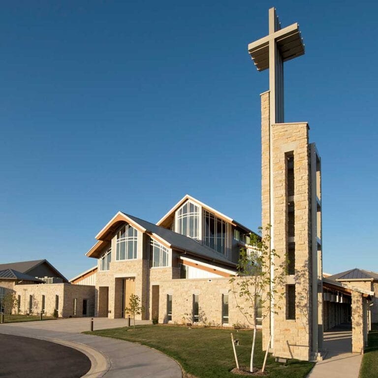 Holy Family Catholic Church, in Fond du Lac, Wisconsin illustrating how modern church architecture may include symbolic references to earlier churches, including separate but attached bell tower and thin transparent wall of the Narthex and Sanctuary