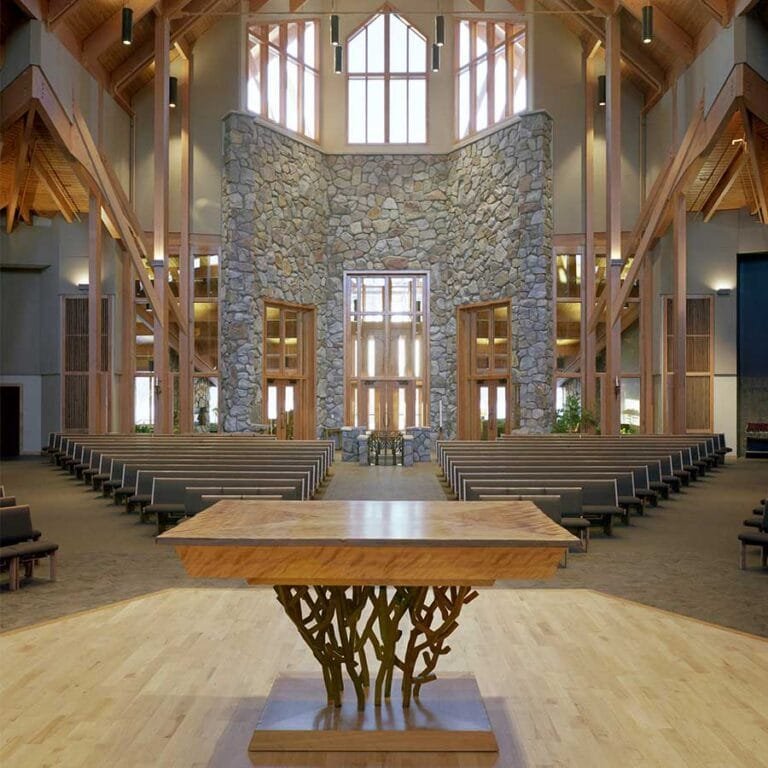 View from behind the Altar at Holy Family Catholic Community, in Woodruff, WI, looking to the Narthex and Baptismal Font. The Sanctuary includes many references to nature and the religious symbolism