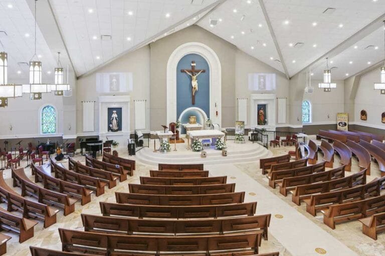 St. Catherine of Siena Catholic Church in Kissimmee, Florida looking towards the raised Alter and religious symbolism
