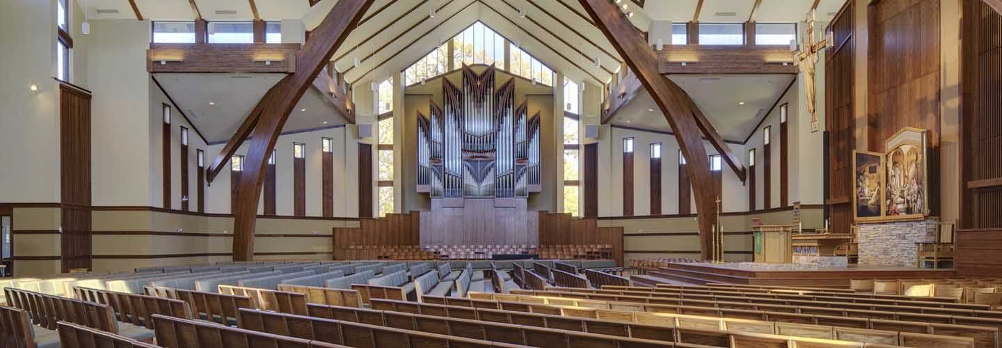 Martin Luther College Chapel, in New Ulm, Minnesota. Glue-laminated heavy timber construction and infill glazing helps to visually frame pipes in the church transept.