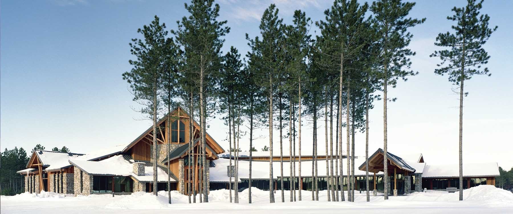 Holy Family Catholic Church in Woodruff, Wisconsin is a contemporary interpretation of Catholic architect. The design of the church incorporates masonry, glue-lam beams and columns, and is designed to provide a peaceful worship in the snowy landscape of upper Wisconsin
